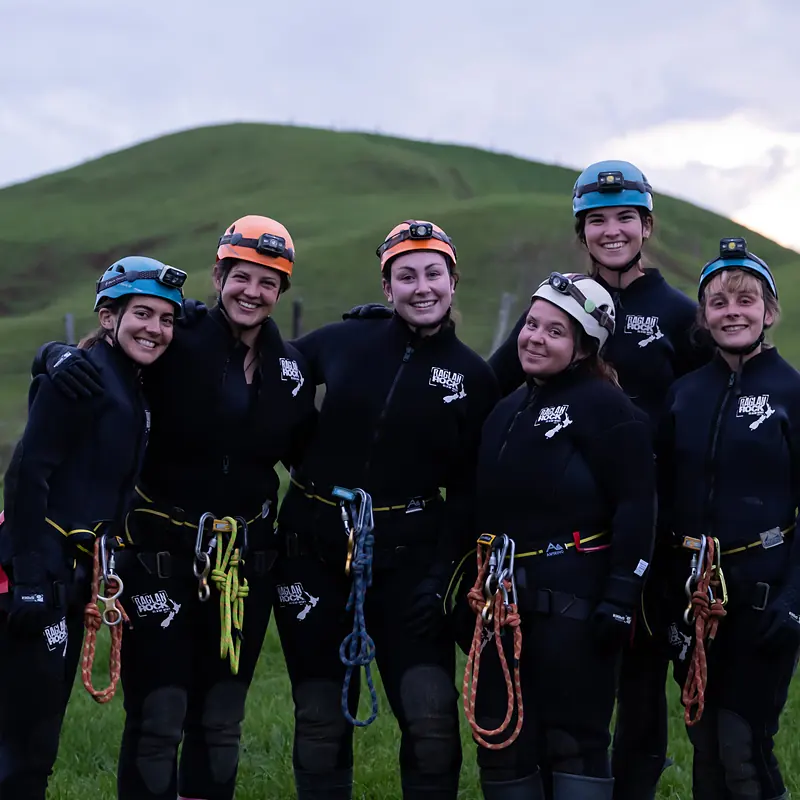Group of canyoners in Raglan Rock wetsuits before the Karioi glowworm canyon