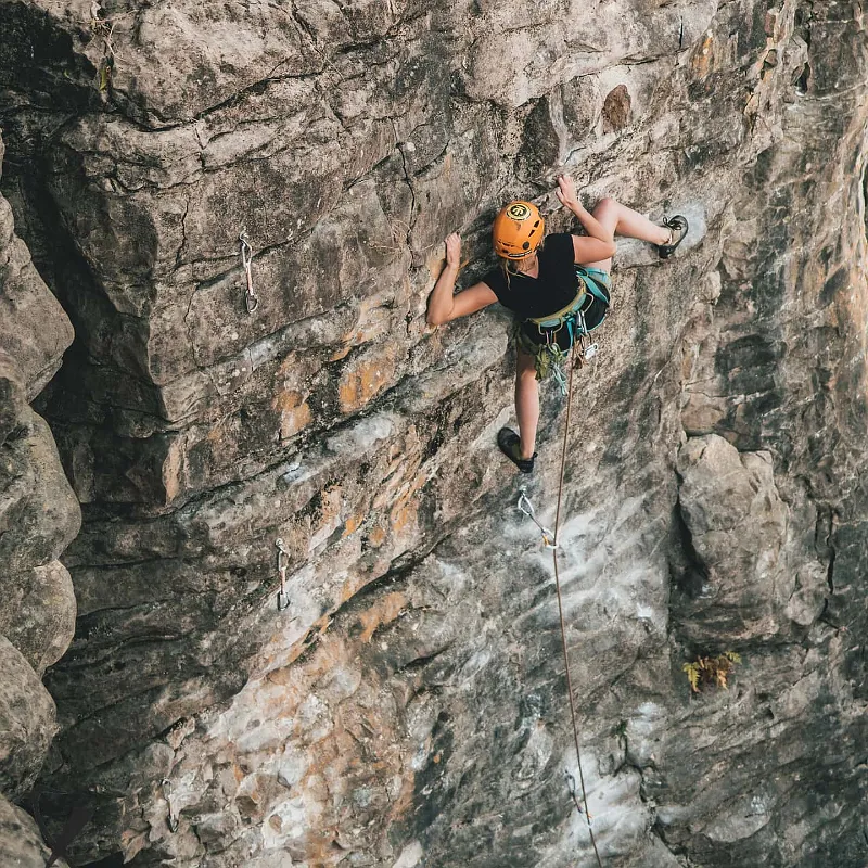 Climber leading a sport route on Raglan rock