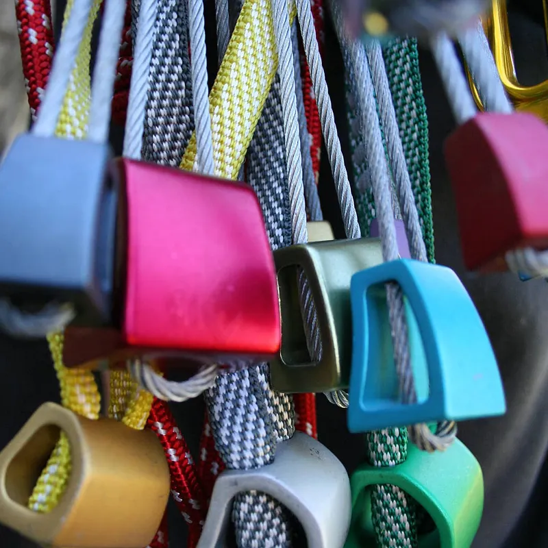 Trad climbing rack and gear on a climbing harness